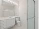Clean bathroom featuring a glass-enclosed shower and a well-lit vanity area at 5539 Octonia Pl, Sarasota, FL 34238