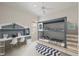 bedroom featuring bunk beds, built in workstation, and neutral decor at 5539 Octonia Pl, Sarasota, FL 34238