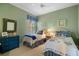 Shared bedroom with matching twin beds and green walls at 5539 Octonia Pl, Sarasota, FL 34238