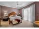 Warm bedroom featuring neutral walls, large windows, and a comfortable bed at 5539 Octonia Pl, Sarasota, FL 34238