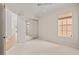 Neutral bedroom featuring stylish mirror closet doors and natural light at 5539 Octonia Pl, Sarasota, FL 34238