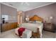 Cozy bedroom with purple walls and a bed with a light colored quilt at 5539 Octonia Pl, Sarasota, FL 34238