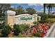 VillageWalk on Palmer Ranch community sign amid colorful landscaping, creating a grand and inviting entrance at 5539 Octonia Pl, Sarasota, FL 34238