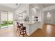 Modern kitchen with granite countertops, stainless steel appliances, and breakfast bar seating for two at 5539 Octonia Pl, Sarasota, FL 34238