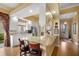 Bright kitchen featuring granite countertops, a breakfast bar, white cabinetry, and stainless steel appliances at 5539 Octonia Pl, Sarasota, FL 34238