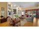 Inviting living room with built-in shelving, comfortable seating, and a serene view of the outdoors at 5539 Octonia Pl, Sarasota, FL 34238