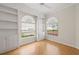 Bright office space with built-in shelving and large arched windows providing lots of natural light at 5539 Octonia Pl, Sarasota, FL 34238