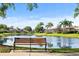 Enjoy a tranquil pond view from a park bench at 5539 Octonia Pl, Sarasota, FL 34238