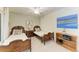 Charming bedroom with two twin beds, vintage-style bed frames, and a ceiling fan at 5710 Palmer Cir # 204, Lakewood Ranch, FL 34211