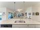 Kitchen island that offers counter seating with clear view to the fireplace and Gathering room at 5710 Palmer Cir # 204, Lakewood Ranch, FL 34211