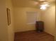 Clean bedroom with wood flooring, a ceiling fan, and a window offering natural light at 5889 Garden Ln # H4, Bradenton, FL 34207