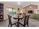 Dining room with sliding glass doors to lanai and an open living space at 6101 34Th W St # 33D, Bradenton, FL 34210