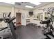 Well-equipped gym space with a variety of exercise machines and weights, and a wall-mounted TV at 6101 34Th W St # 33D, Bradenton, FL 34210