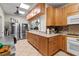 Functional kitchen with stainless steel appliances, tiled flooring, and a pass through window at 6101 34Th W St # 33D, Bradenton, FL 34210