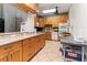 Functional kitchen with ample counter space and stainless steel appliances and view to a door at 6101 34Th W St # 33D, Bradenton, FL 34210