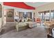 Comfortable living room with cozy seating, stylish decor, and access to an outdoor balcony at 6101 34Th W St # 33D, Bradenton, FL 34210