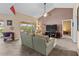 Comfortable living room with vaulted ceilings and sliding glass doors to a screened lanai at 6101 34Th W St # 33D, Bradenton, FL 34210