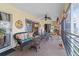 Spacious screened patio with comfortable seating, decor, and views of the surrounding community at 6101 34Th W St # 33D, Bradenton, FL 34210
