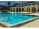 Inviting community pool surrounded by lounge chairs and well-maintained landscaping at 6101 34Th W St # 33D, Bradenton, FL 34210