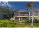 Condo with large screened lanai overlooking lush tropical landscaping and palm trees at 6101 34Th W St # 33D, Bradenton, FL 34210