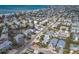 Discover the charm of this seaside neighborhood from above, where homes are nestled among palm trees near the beach at 6201 Holmes Blvd, Holmes Beach, FL 34217
