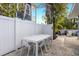 Outdoor dining area with table and chairs and outdoor seating near the pool at 6201 Holmes Blvd, Holmes Beach, FL 34217