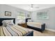 Charming bedroom with two twin beds, ceiling fan, and plenty of natural light at 6201 Holmes Blvd, Holmes Beach, FL 34217