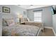 Charming bedroom with twin beds, ceiling fan, and coastal decor at 6201 Holmes Blvd, Holmes Beach, FL 34217