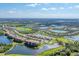 Luxury community featuring a golf course, ponds, lush green spaces, and luxury townhomes at 6504 Grand Estuary Trl # 103, Bradenton, FL 34212