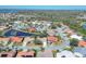 Expansive aerial shot of a residential area featuring homes, roads, ponds and green spaces at 6911 Stetson Street Cir, Sarasota, FL 34243