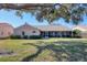 The backyard features a screened-in porch ideal for outdoor living and entertaining at 6911 Stetson Street Cir, Sarasota, FL 34243