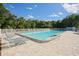 Enjoy this community pool with lounge chairs, a refreshing retreat under the bright, sunny sky at 6911 Stetson Street Cir, Sarasota, FL 34243