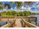 Scenic view of the community dock surrounded by lush greenery and serene water views at 6911 Stetson Street Cir, Sarasota, FL 34243