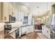 Kitchen has granite countertops, stainless steel appliances, and opens up into an adjacent dining room at 6911 Stetson Street Cir, Sarasota, FL 34243
