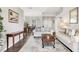 Spacious living room with neutral colors, wood floors, with open layout to the dining area at 6911 Stetson Street Cir, Sarasota, FL 34243