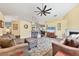 Open-concept living room flows seamlessly into the kitchen with breakfast bar and dining area at 6911 Stetson Street Cir, Sarasota, FL 34243