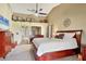Inviting main bedroom featuring vaulted ceiling, plush carpet, and an ensuite bathroom at 6911 Stetson Street Cir, Sarasota, FL 34243