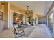 Spacious screened-in patio featuring comfortable seating and scenic views of the well-maintained backyard at 6911 Stetson Street Cir, Sarasota, FL 34243
