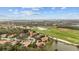 A stunning neighborhood aerial view highlighting golf courses, ponds, and beautiful homes at 6919 Winners Cir, Lakewood Ranch, FL 34202