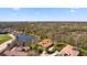 Stunning aerial view of a luxury home near a lake, golf course and beautiful landscaping at 6919 Winners Cir, Lakewood Ranch, FL 34202
