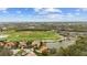 An aerial view overlooking homes, a golf course, and other amenities in a residential neighborhood at 6919 Winners Cir, Lakewood Ranch, FL 34202