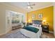 Bedroom features a bay window, neutral colors, and a ceiling fan at 6919 Winners Cir, Lakewood Ranch, FL 34202
