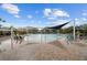 Community pool with shaded areas, plenty of chairs and tables, and a brick patio at 6919 Winners Cir, Lakewood Ranch, FL 34202