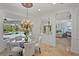 Elegant dining area with views of the pool, modern chandelier, and seamless access to other living spaces at 6919 Winners Cir, Lakewood Ranch, FL 34202