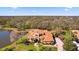 Beautiful Mediterranean-style home with lush landscaping, a circular driveway, and a grand entrance at 6919 Winners Cir, Lakewood Ranch, FL 34202