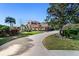 Charming home with a paver driveway, lush landscaping, and a well-manicured lawn at 6919 Winners Cir, Lakewood Ranch, FL 34202