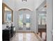 Elegant foyer with decorative glass double doors, tiled floors, and a view into the home at 6919 Winners Cir, Lakewood Ranch, FL 34202