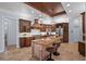 Spacious kitchen featuring wood cabinets, stainless steel appliances, and granite countertops at 6919 Winners Cir, Lakewood Ranch, FL 34202