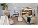 Open living space with a fireplace flowing into an eat-in-kitchen in a well-lit space at 6919 Winners Cir, Lakewood Ranch, FL 34202