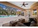 Outdoor seating area with a view of the pool, screened patio, and backyard, perfect for entertaining guests at 6919 Winners Cir, Lakewood Ranch, FL 34202